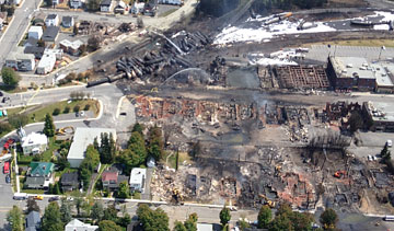 An aerial shot shows the aftermath of the derailment, explosions and fire that leveled part of Lac-Megantic, Que., July 6, 2013. PHOTO Transportation Safety Board of Canada