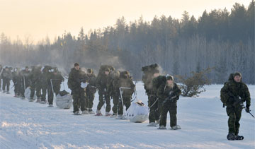 Canadian Brigade Group 33 trek with their snowshoes and kit  during winter training. PHOTO: MCpl Tanya Tobin © 2011 DND-MDN Canada