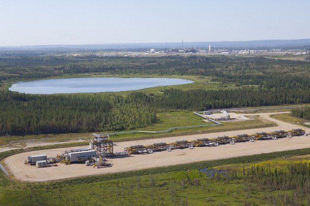 Aerial of Nexen's Long Lake pad 13 in the foreground with the Long Lake SAGD processing facility in the distance. PHOTO: Courtesy of Nexen