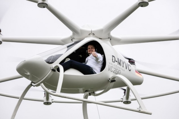 e-volo Managing Director Alexander Zosel gives thumbs up  as he pilots the Volocopter at an Airfield in Southern Germany. PHOTO:PRNewsFoto/e-volo