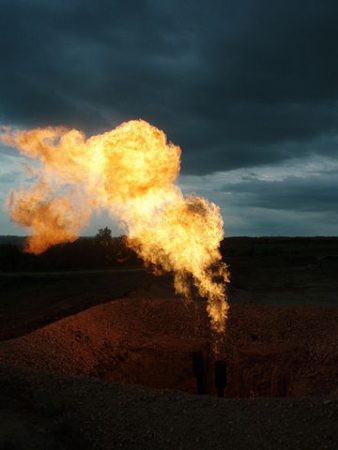 Flaring of gas at a Bakken formation production site. PHOTO: Joshua Doubek, via Wikimedia Commons