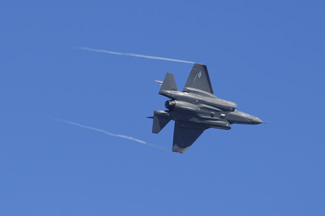 An F-35 Lightning II maneuvers over an airbase in Florida.