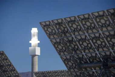 A thermal storage tower uses solar energy to store heat in molten salt. The stored energy can then be converted to electricity using turbines. PHOTO: SolarReserve